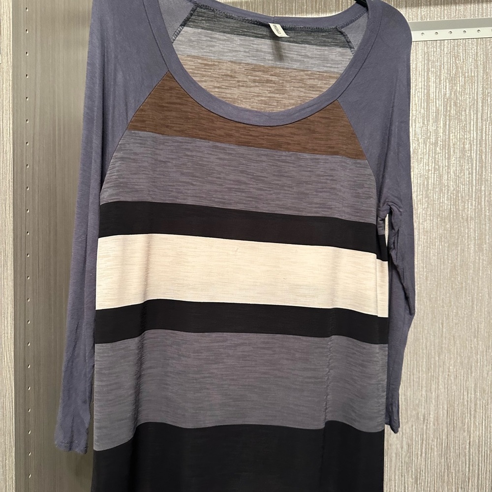 Grayish-blue, black, white, and tan blouse tunic.